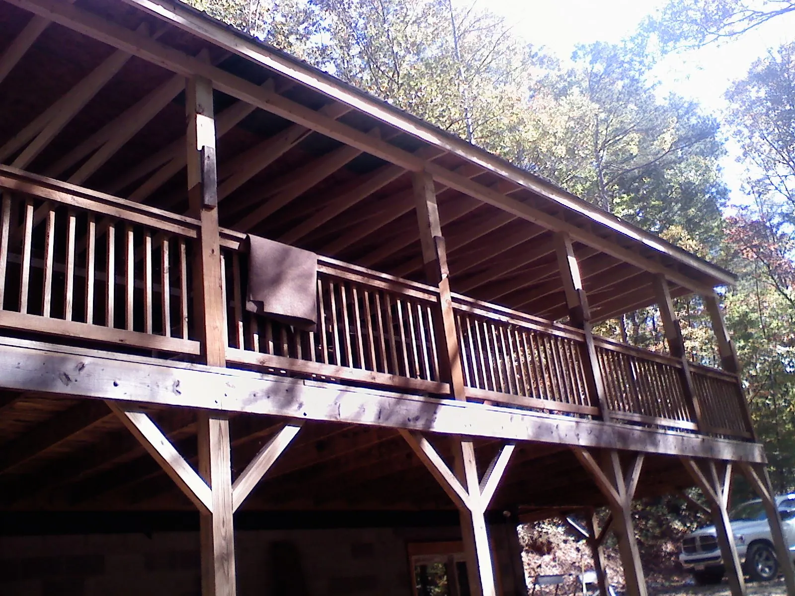 Timber framing under a new elevated porch and deck — Roof Leak Repair in Riga by Roofing Brothers